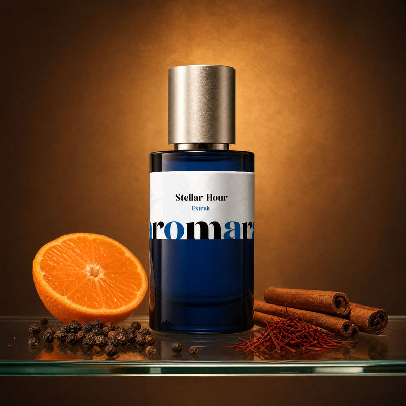 Stellar Hour perfume bottle with halved mandarin, black peppercorns, saffron threads and cinnamon sticks, amber spiced dupe by Aromara