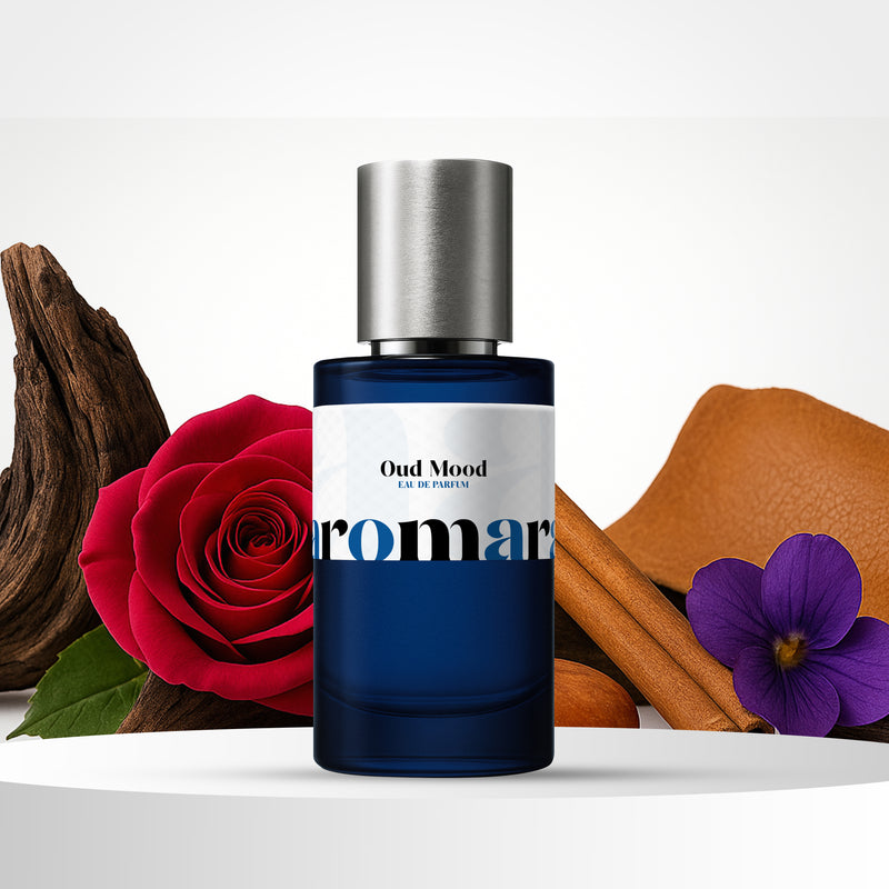 Perfume bottle labeled 'Oud Mood' with a red rose, cinnamon stick, and purple flower on a white background