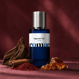 Imperial Noir Extreme perfume bottle with oud, saffron, cinnamon and amber on deep maroon, commanding oriental dupe by Aromara