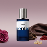 Nomade by Aromara on a dusty mauve and soft plum background with a rose, saffron, leather, oud wood and frankincense. 35% Extrait, inspired by Louis Vuitton Ombre Nomade.