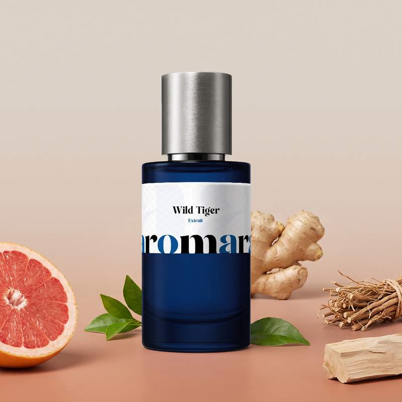 Wild Tiger by Aromara on a pale stone beige to soft clay terracotta background with pink grapefruit, ginger root, vetiver roots, green leaves and pale wood. 35% Extrait, inspired by Bvlgari Tygar.
