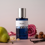 Direction by Aromara on a pale pearl grey and soft smoky rose background with pear, hazelnuts, rose, frankincense and vanilla pods. 35% Extrait, inspired by Amouage Guidance.