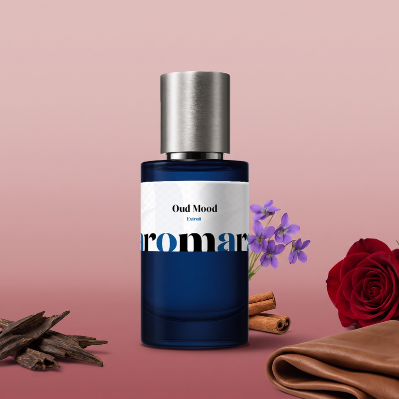 Oud Mood by Aromara on a pale dusty rose to soft rosewood pink background with oud wood chips, a red rose, violets, cinnamon sticks and soft leather. 35% Extrait, inspired by Maison Francis Kurkdjian Oud Satin Mood.
