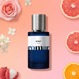 KOKO by Aromara on a pale grapefruit coral to peach pink background with a pink rose, jasmine, grapefruit, lychees and orange. 35% Extrait, inspired by Chanel Coco Mademoiselle.