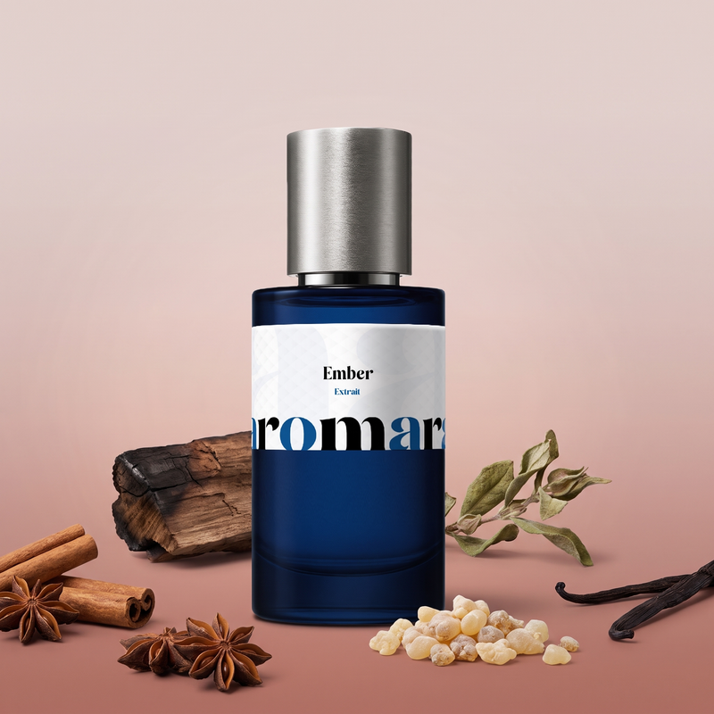 Ember by Aromara on a pale smoky blush to soft burnt sienna rose background with cinnamon sticks, star anise, frankincense resin, vanilla pods and smoked wood. 35% Extrait, inspired by Tom Ford Amber Absolute.