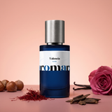 Valencia by Aromara on a pale coral blush to soft rosewood pink background with a pink rose, saffron threads, oud wood chips, hazelnuts and vanilla pods. 35% Extrait, inspired by Lancome Oud Bouquet.