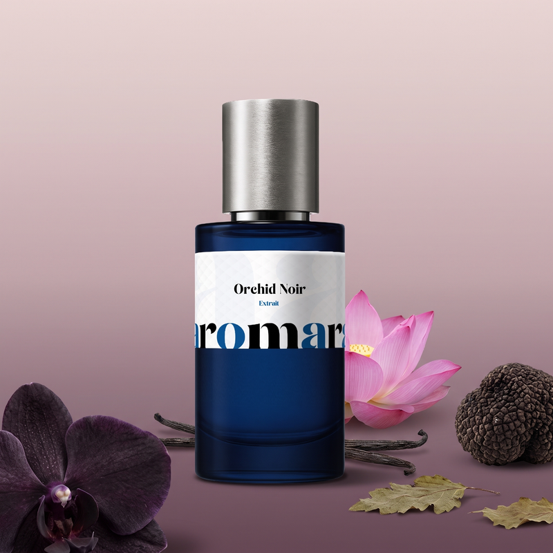 Orchid Noir by Aromara on a pale smoky blush to soft dusky plum background with a dark orchid, a black truffle, a pink lotus, vanilla pods and patchouli leaves. 35% Extrait, inspired by Tom Ford Black Orchid.