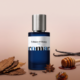 Tobacco & Honey by Aromara on a pale smoky blush and soft clove brown background with tobacco leaves, a honey dipper, vanilla pods, cloves and amber resin. 35% Extrait, inspired by Guerlain Tobacco Honey.