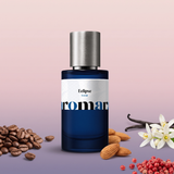Eclipse by Aromara on a pale blush pink and soft dusky violet background with coffee beans, orange blossom, vanilla pods, almonds and pink peppercorns. 35% Extrait, inspired by Yves Saint Laurent Black Opium.