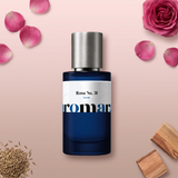 Rose No. 31 by Aromara on a pale blush pink to cedar taupe background with a pink rose, rose petals, cumin seeds and cedar wood. 35% Extrait, inspired by Le Labo Rose 31.