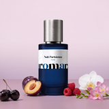 Nuit Parisienne by Aromara on a pale lilac blush to plum mauve background with black cherries, a plum, raspberries, a white orchid and freesia. 35% Extrait, inspired by Maison Asrar Night in Paris.