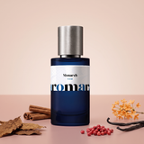Monarch by Aromara on a pale sand blush to soft cinnamon rose background with tobacco leaves, cinnamon sticks, pink peppercorns, vanilla pods and osmanthus flowers. 35% Extrait, inspired by Parfums de Marly Herod.