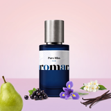 Pure Bliss by Aromara on a pale ballet pink to lilac rose background with a pear, blackcurrants, an iris flower, jasmine and vanilla pods. 35% Extrait, inspired by Lancôme La Vie Est Belle.