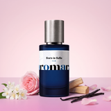 Born in Bella by Aromara on a pale petal pink to soft fuchsia pink background with jasmine flowers, a pink rose, vanilla pods, sandalwood and rose petals. 35% Extrait, inspired by Valentino Born in Roma.