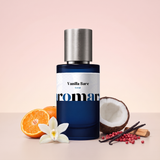 Vanilla Bare by Aromara on a pale shell pink to soft creamy blush background with a halved mandarin, a vanilla orchid, a halved coconut, pink peppercorns and vanilla pods. 35% Extrait, inspired by Phlur Vanilla Skin.