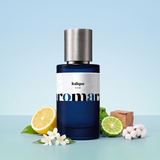 Italique by Aromara on a pale Mediterranean sky blue to sea-glass aqua background with a lemon, jasmine, bergamot, cedarwood and cotton flowers. 35% Extrait, inspired by Xerjoff Italica.