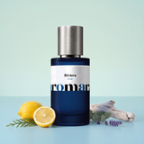 Riviera by Aromara on a pale eucalyptus mint to Riviera aqua background with lemons, cypress, driftwood, eucalyptus leaves and lavender. 35% Extrait, inspired by Tom Ford Costa Azzurra.
