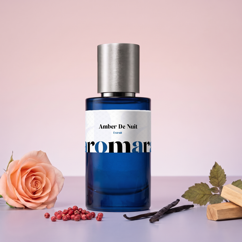 Amber De Nuit by Aromara on a pale dusk rose to twilight mauve background with a peach rose, pink peppercorns, vanilla pods, patchouli leaves and sandalwood. 35% Extrait, inspired by Dior Ambre Nuit.