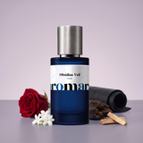 Obsidian Veil by Aromara on a pale smoky lilac to dusky plum grey background with a red rose, jasmine, black leather, oud wood and sandalwood. 35% Extrait, inspired by Guerlain Santal Royal.