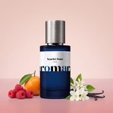 Scarlet Dune by Aromara on a pale desert sand pink to scarlet raspberry rose background with raspberries, a mandarin, orange blossom, jasmine and vanilla pods. 35% Extrait, inspired by Ex Nihilo Scarlet Sands.