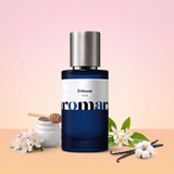 Frisson by Aromara on a pale apple blossom pink to soft orange blossom peach background with apple blossom, a honey pot and dipper, orange blossom, vanilla pods and white cotton. 35% Extrait, inspired by Initio Addictive Vibration.