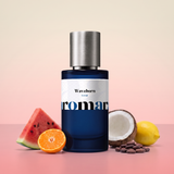 Waveborn by Aromara on a pale coconut cream to watermelon pink background with a watermelon slice, a halved mandarin, a halved coconut, a lemon and cocoa beans. 35% Extrait, inspired by Room 1015 Wavechild.