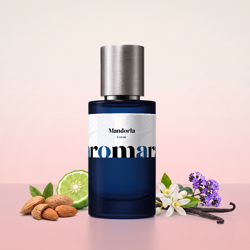 Mandorla by Aromara on a pale almond-blossom white to almond-blossom pink background with almonds, a halved bergamot, orange blossom, heliotrope and vanilla pods. 35% Extrait, inspired by Acqua di Parma Mandorlo di Sicilia.
