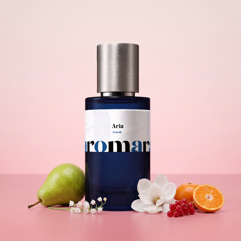 Aria by Aromara on a pale magnolia blush to soft redcurrant pink background with a green pear, lily of the valley, a white magnolia, redcurrants and a halved mandarin. 35% Extrait, inspired by Loewe Aire Sutileza.