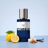Capri by Aromara on a pale powder blue to Capri blue background with lemons, sugar cubes, almonds and vanilla pods. 35% Extrait, inspired by Kayali Capri Lemon Sugar 14.