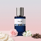 Moon Silk by Aromara on a pale moonstone grey to soft silk blush pink background with ivory silk, a pale pink rose, jasmine and gardenia flowers and oud wood chips. 35% Extrait, inspired by Memo Paris Moon Fever.