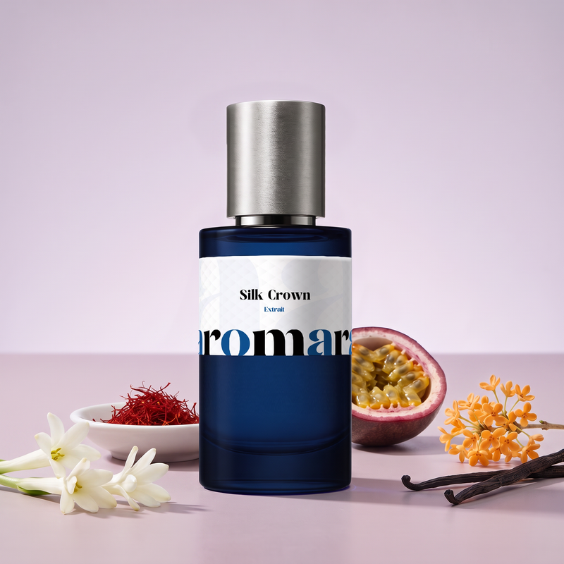 Silk Crown by Aromara on a pale lilac to dusty mauve background with tuberose, saffron, a halved passionfruit, osmanthus and vanilla pods. 35% Extrait, inspired by Creed Queen of Silk.