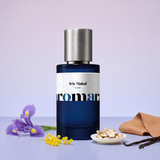 Iris Mahal by Aromara on a pale powder lavender to soft iris periwinkle background with an iris flower, mimosa, orris root, vanilla pods and soft leather. 35% Extrait, inspired by Iris Malikhân by Maison Crivelli.